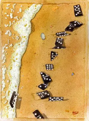 Dominoes scattered on a sandy beach.